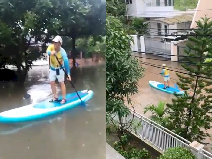 Tiru Susi Pudjiastuti, Bapak Ini Patroli Pakai Paddle di Tengah Banjir