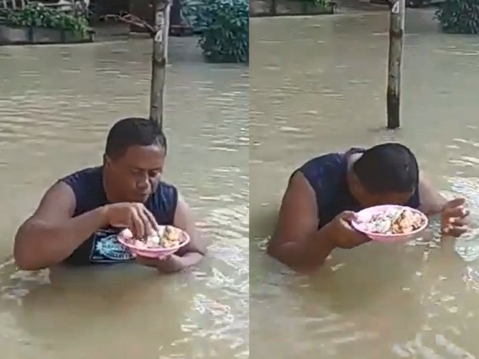 Kocak, Pria Ini Tetap Makan Meski Sekitarnya Sedang Banjir 