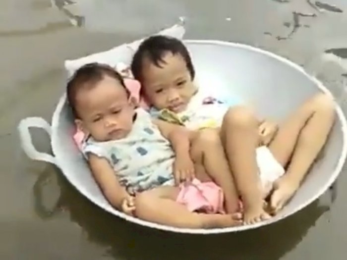 Bocah Naik Penggorengan saat Banjir, Netizen: Santuy Syekali 