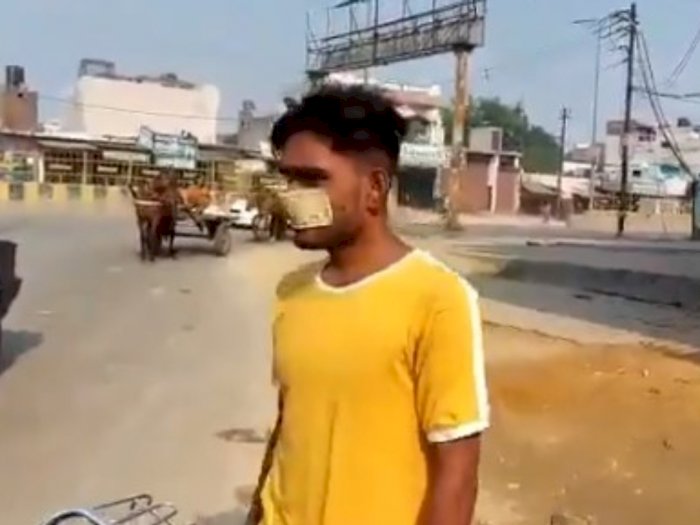 Aksi Nyeleneh Pria India, Gunakan Uang 10 Rupee Sebagai Pengganti Masker