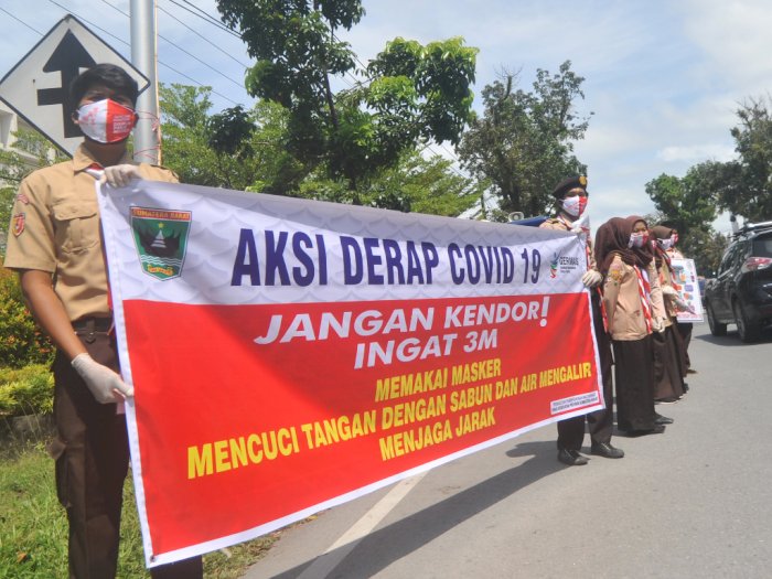 FOTO: Aksi Derap COVID-19 di Padang