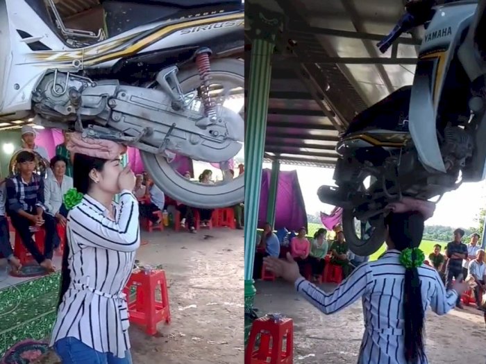 Kuat Banget! Wanita Cantik Ini Angkat Motor Pakai Kepala, Netizen Khawatirkan Suaminya