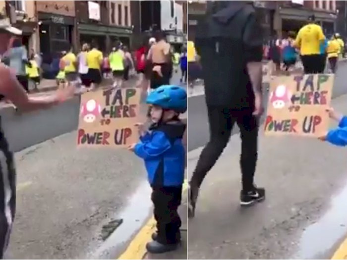 Aksi Menggemaskan Bocah Acungkan 'Papan Semangat' ke Peserta Maraton, Tapi Ada yang Cuek