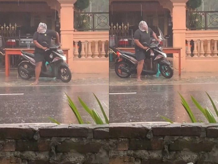 Pemotor Bungkus Kepalanya Pakai Kantong Plastik saat Hujan, Kebingungan Lihat Kanan Kiri