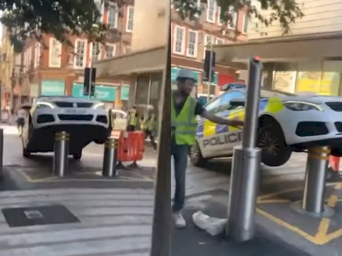 Mobil Polisi Ini Terangkat Usai Parkir Sembarangan di Pembatas Jalan!
