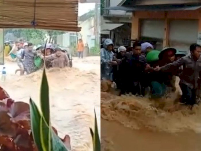 Viral Aksi Heroik Polisi Selamatkan Emak-emak dari  Banjir di Tengah Guyuran Hujan