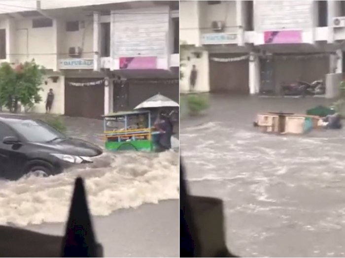 Nyesek! Mobil Ini Terobos Banjir, Bikin Pedagang Keliling dan Gerobaknya Terhempas
