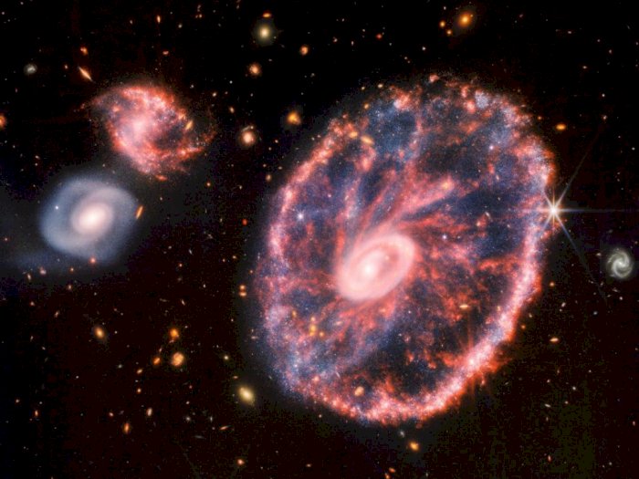 Teleskop Webb Tangkap Gambar Warna-Warni Galaksi Cartwheel, Hasilnya Jernih Banget!