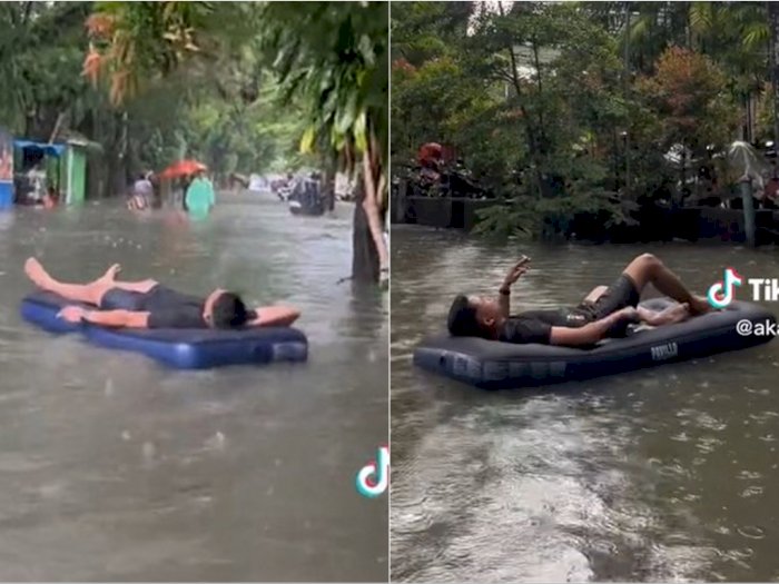 Bukannya Ngungsi, Pria Ini Malah Santai Rebahan Sambil Ngerokok di Kasur Karet pas Banjir