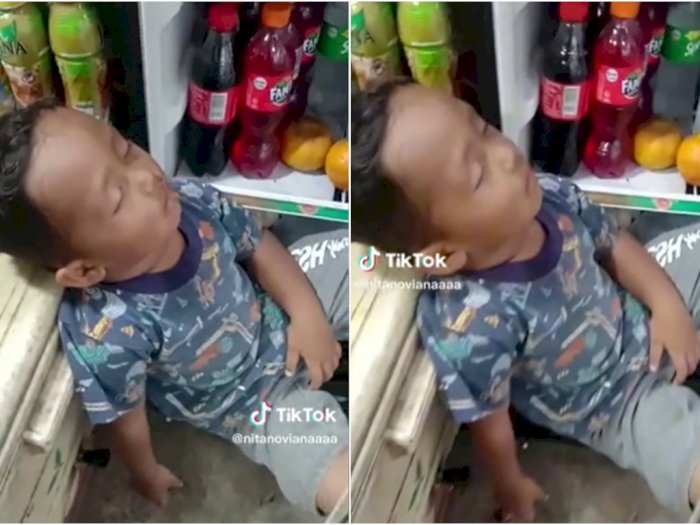 Kocak! Bocah Ini Tidur di Depan Kulkas yang Terbuka Akibat Terlalu Panas karena Puasa